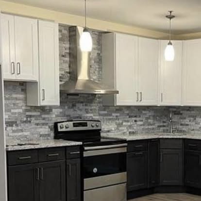 Two-tone kitchen with a stacked-stone accent — backsplash installation by GT Stone and Cabinets Installation in South Amboy, NJ