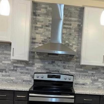 Two-tone kitchen with a stacked-stone accent — photo 10 of 10, by GT Stone and Cabinets Installation in South Amboy, NJ