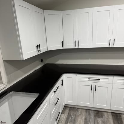White kitchen, black-and-white quartz — completed by GT Stone and Cabinets Installation in South Amboy, NJ