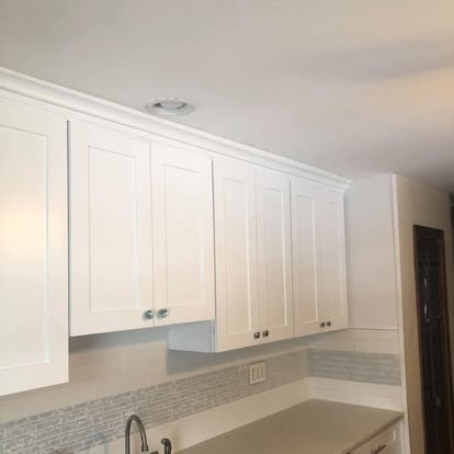 White kitchen with a curved breakfast bar — photo 2 of 13, by GT Stone and Cabinets Installation in South Amboy, NJ