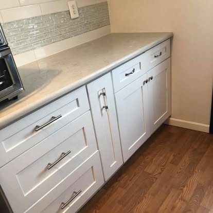 White kitchen with a curved breakfast bar — photo 4 of 13, by GT Stone and Cabinets Installation in South Amboy, NJ