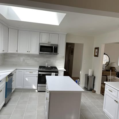 Bright white kitchen under a skylight — photo 2 of 9, by GT Stone and Cabinets Installation in South Amboy, NJ