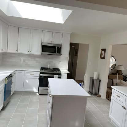 Bright white kitchen under a skylight — photo 8 of 9, by GT Stone and Cabinets Installation in South Amboy, NJ